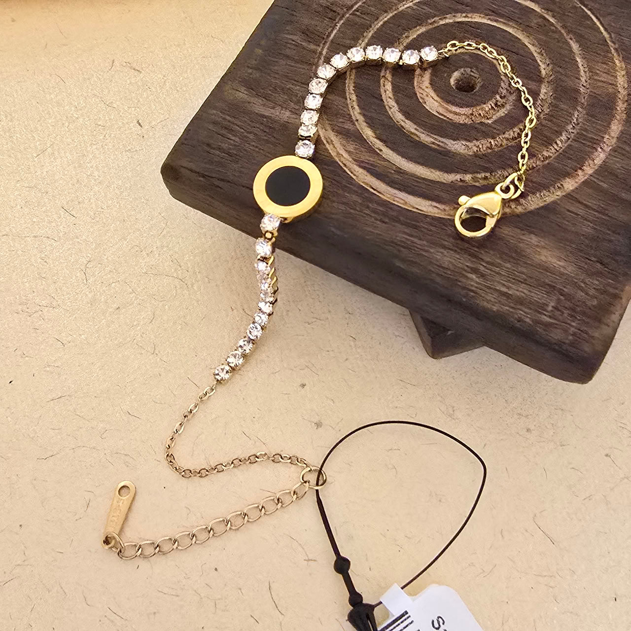 Gold Crystal Charm Bracelet with Black Accent