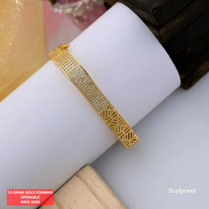 1.5 gram gold forming openable bangle, gold tone designer bangle with white stone detailing, geometric cutwork gold bangle, stone studded openable bangle, elegant gold finish bangle, contemporary forming jewellery, slim designer bangle for festive wear, Scofjewel BRFG 5059