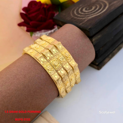 1.5 gram gold forming designer bangles set, four piece traditional gold tone bangles for women, engraved gold look bangles with circular motifs, geometric pattern imitation bangles, floral detailing traditional bangles, ethnic wedding wear bangles, festive gold forming bangles, BGFG 5132 Scofjewel