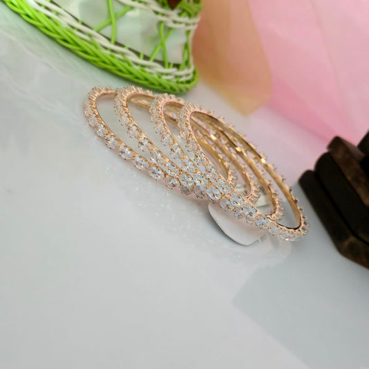 AD oval cut bangles for women, american diamond designer bangles, four row oval stone bangles, gold finish AD bangles, sparkling CZ bangles, bridal party wear bangles, artificial diamond jewellery