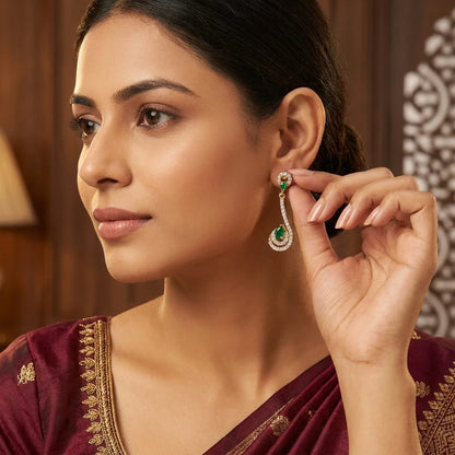 AD zirconia green stone earrings, designer drop earrings, gold ethnic earrings, emerald zirconia earrings, festive womens earrings, long party wear earrings, water resistant earrings