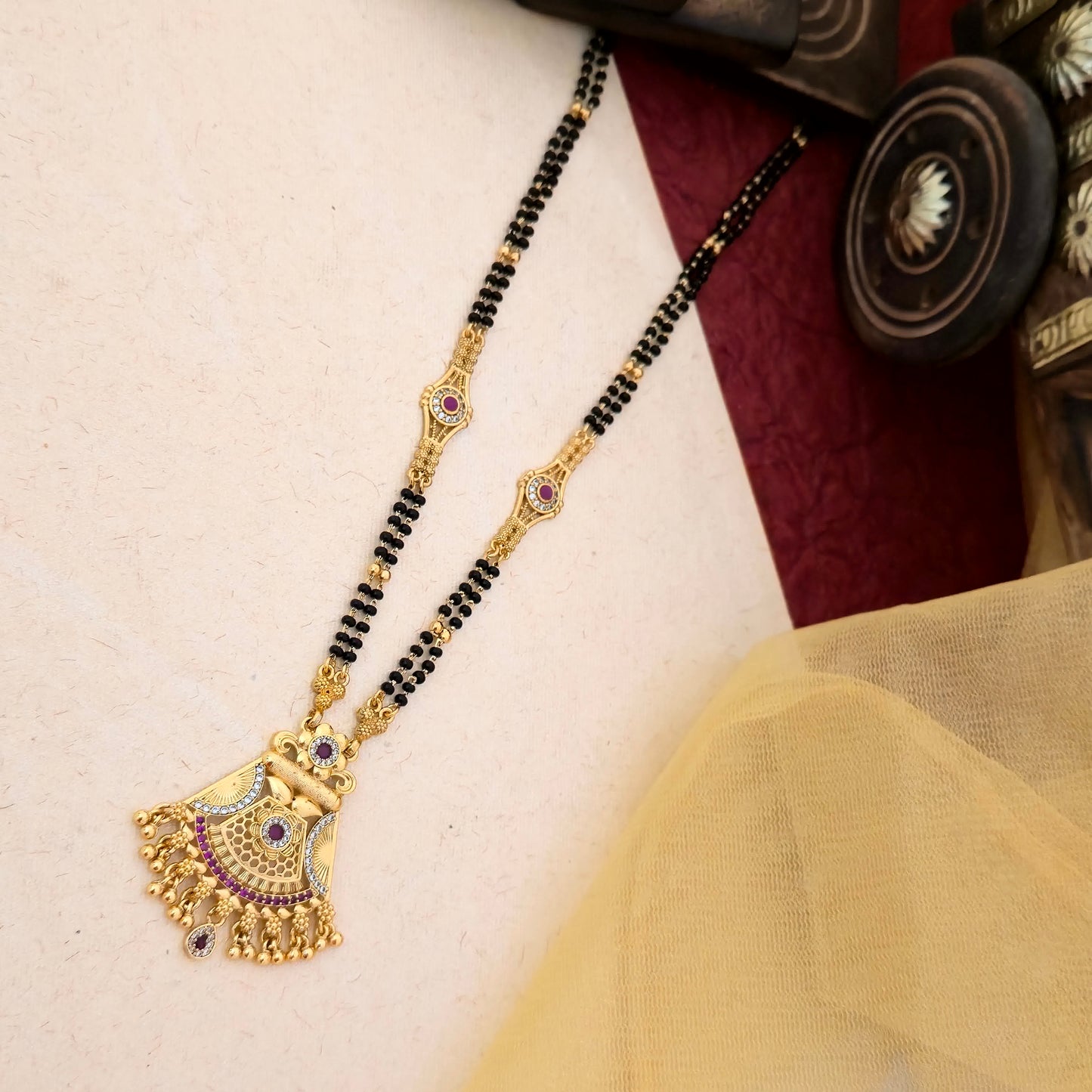 fan mangalsutra, antique gold mangalsutra, purple stone mangalsutra, black bead mangalsutra, traditional indian mangalsutra, daily wear mangalsutra