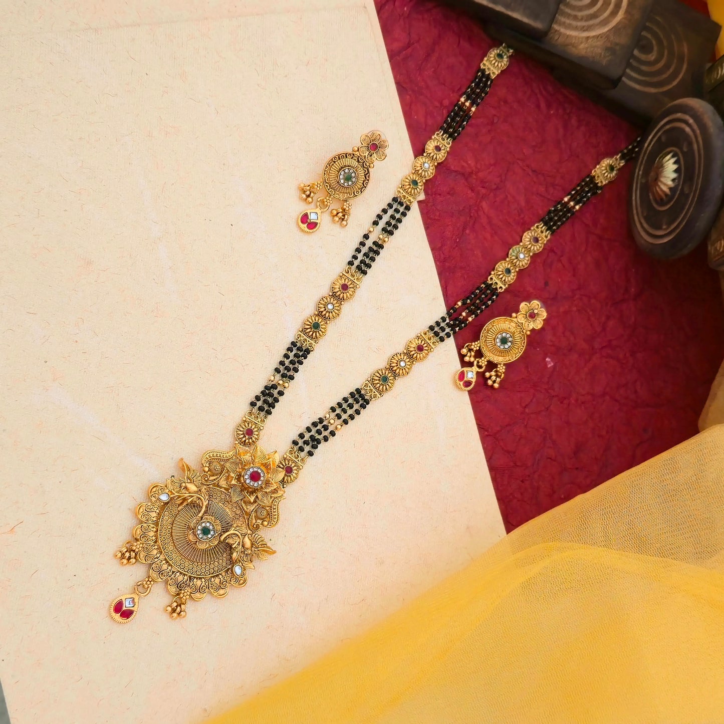 floral temple mangalsutra, antique gold mangalsutra set, black bead mangalsutra, multicolor stone mangalsutra, traditional indian mangalsutra, imitation jewellery mangalsutra