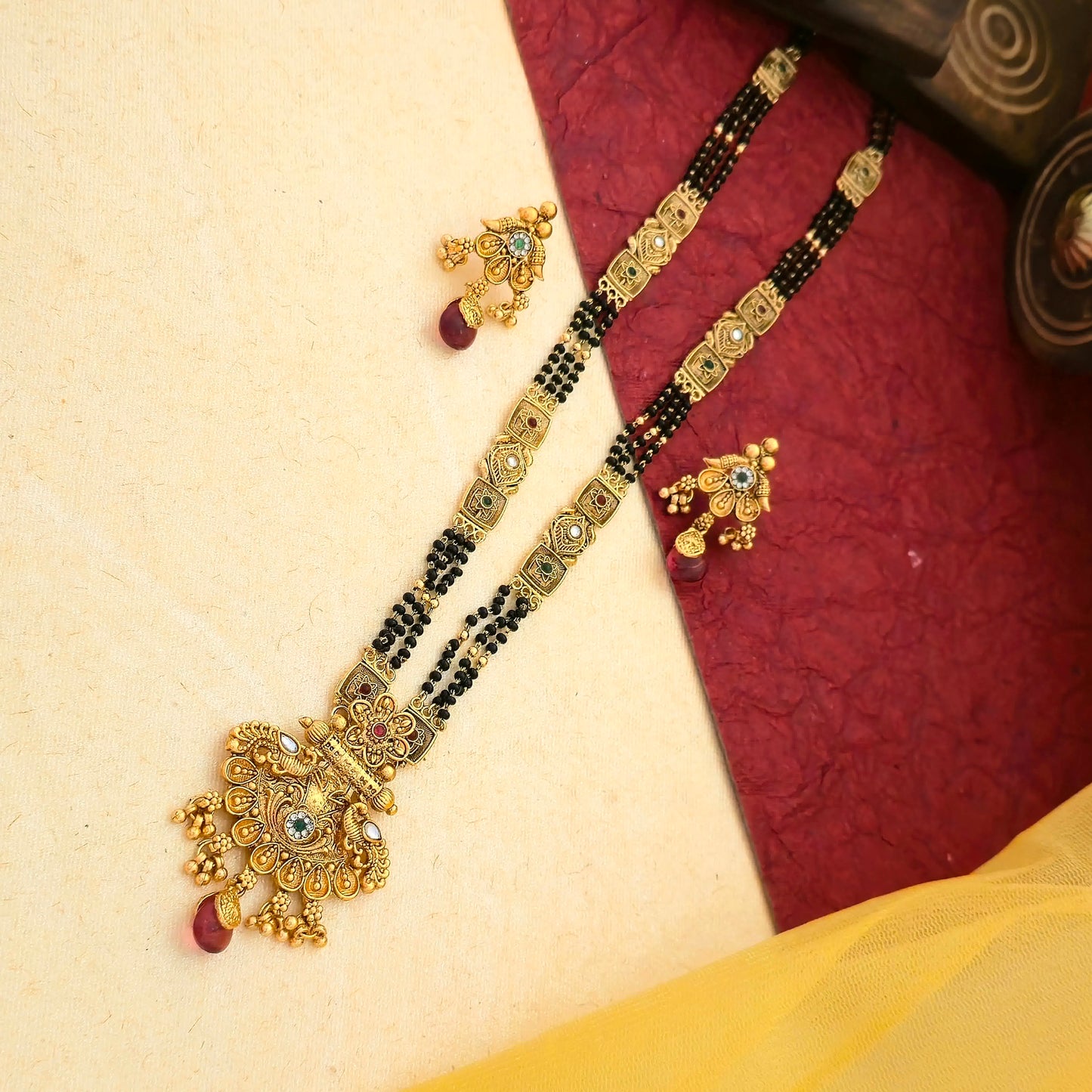 floral temple mangalsutra, ruby drop mangalsutra, antique gold mangalsutra set, black bead mangalsutra, multicolor stone mangalsutra, traditional indian mangalsutra