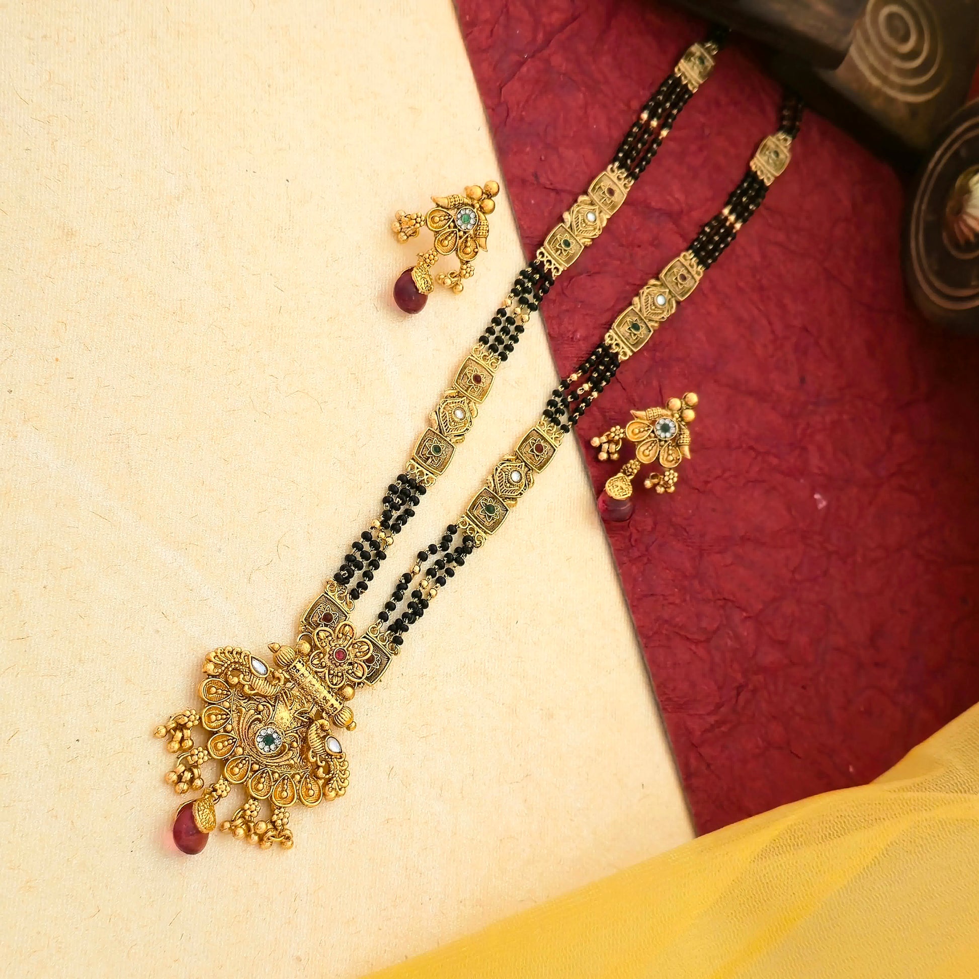 floral temple mangalsutra, ruby drop mangalsutra, antique gold mangalsutra set, black bead mangalsutra, multicolor stone mangalsutra, traditional indian mangalsutra