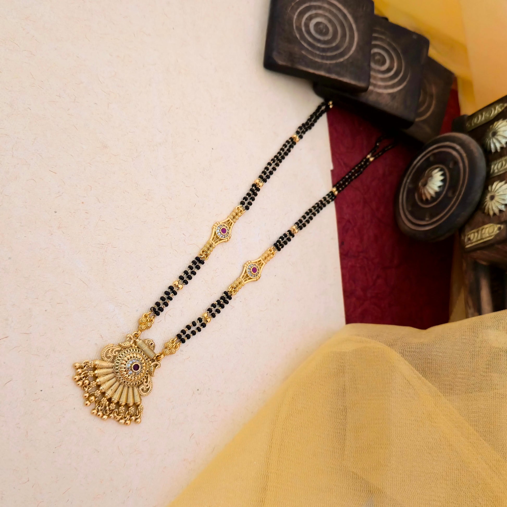 peacock mangalsutra, antique gold mangalsutra, black bead mangalsutra, traditional indian mangalsutra, stone pendant mangalsutra, daily wear mangalsutra