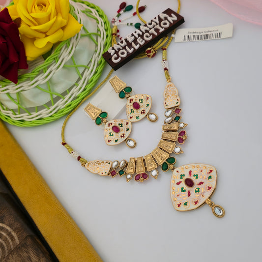 antique gold tone meenakari necklace set, cream enamel necklace with maroon and green stones, traditional Indian necklace with matching earrings, multicolour floral meenakari jewellery set, geometric pendant necklace with white teardrop stones, maroon green stone artificial necklace, antique finish ethnic jewellery for women, traditional wedding necklace set with matching earrings