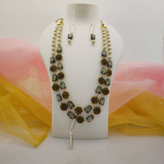 black and maroon beads double layer necklace mala, cream pearl necklace mala with matching earrings, gold tone artificial jewellery necklace set for women, black beads necklace with maroon decorative beads, traditional double layer necklace mala for festive wear, imitation jewellery necklace set for women