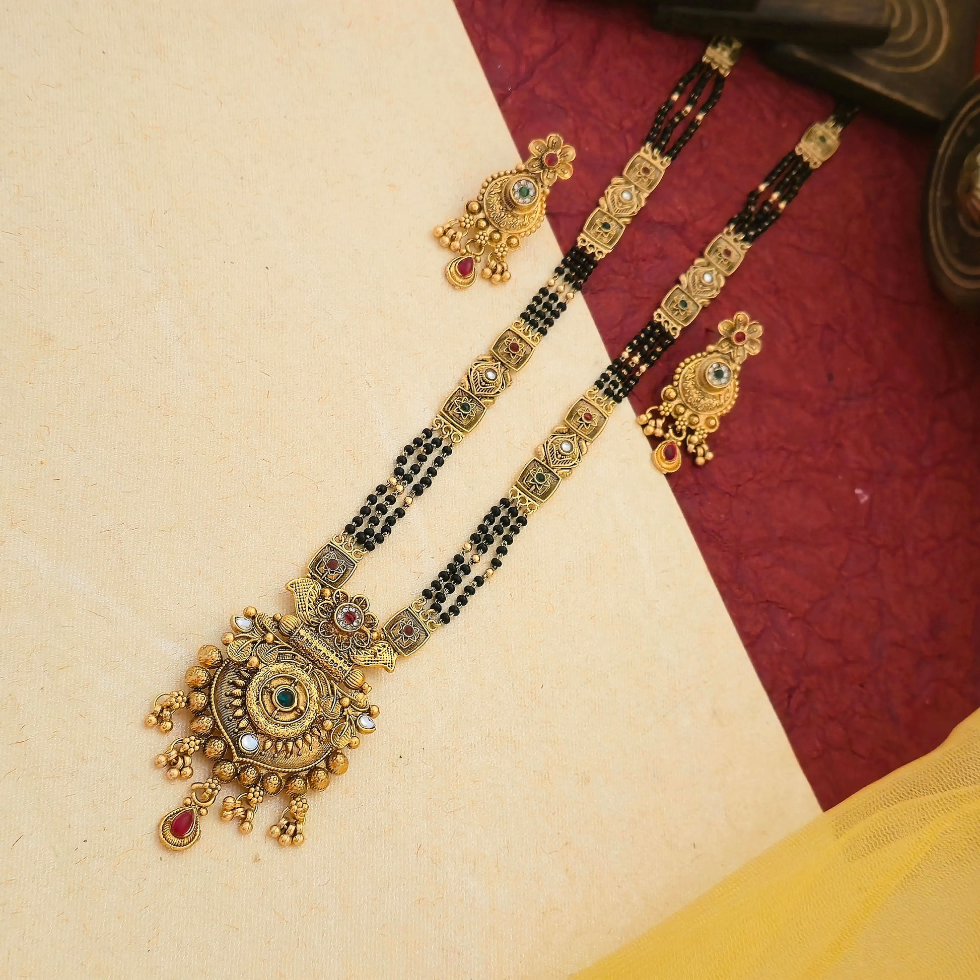 gold plated mangalsutra set, floral pendant mangalsutra, black bead mangalsutra with earrings, multicolor stone mangalsutra, traditional indian mangalsutra set, imitation gold mangalsutra