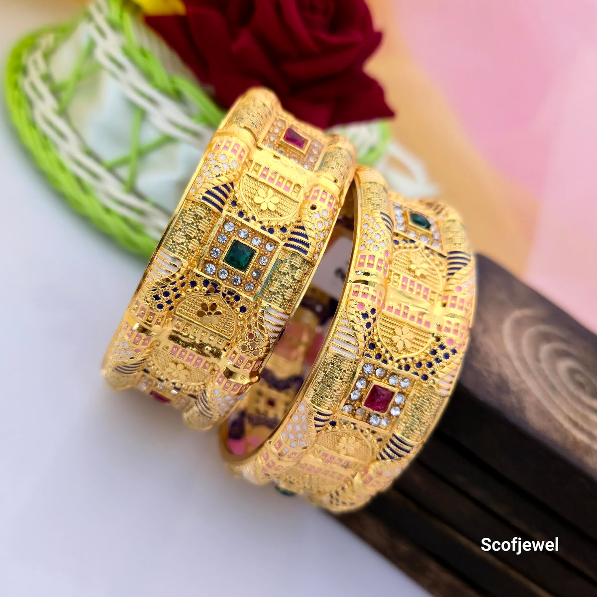 old tone designer bangles with multicolour detailing, traditional Kundan style bangles for women, broad ornamental gold bangles with square stone settings, pink blue and green accent bangles, gold tone ethnic jewellery for weddings, traditional Indian designer bangles, festive wear bangles with decorative patterns, Scofjewel designer bangles