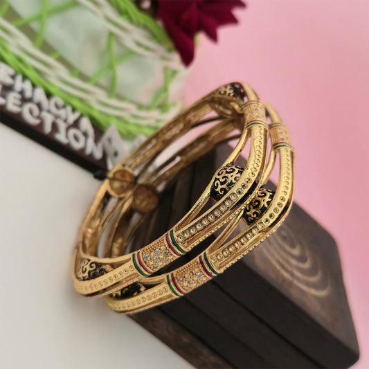 gold tone designer bangles with black enamel detailing, traditional gold finish bangles for women, decorative imitation bangles with red and green accents, ethnic designer bangles for festive wear, gold tone fashion jewellery for women, traditional Indian bangles with intricate patterns, Scofjewel designer bangles