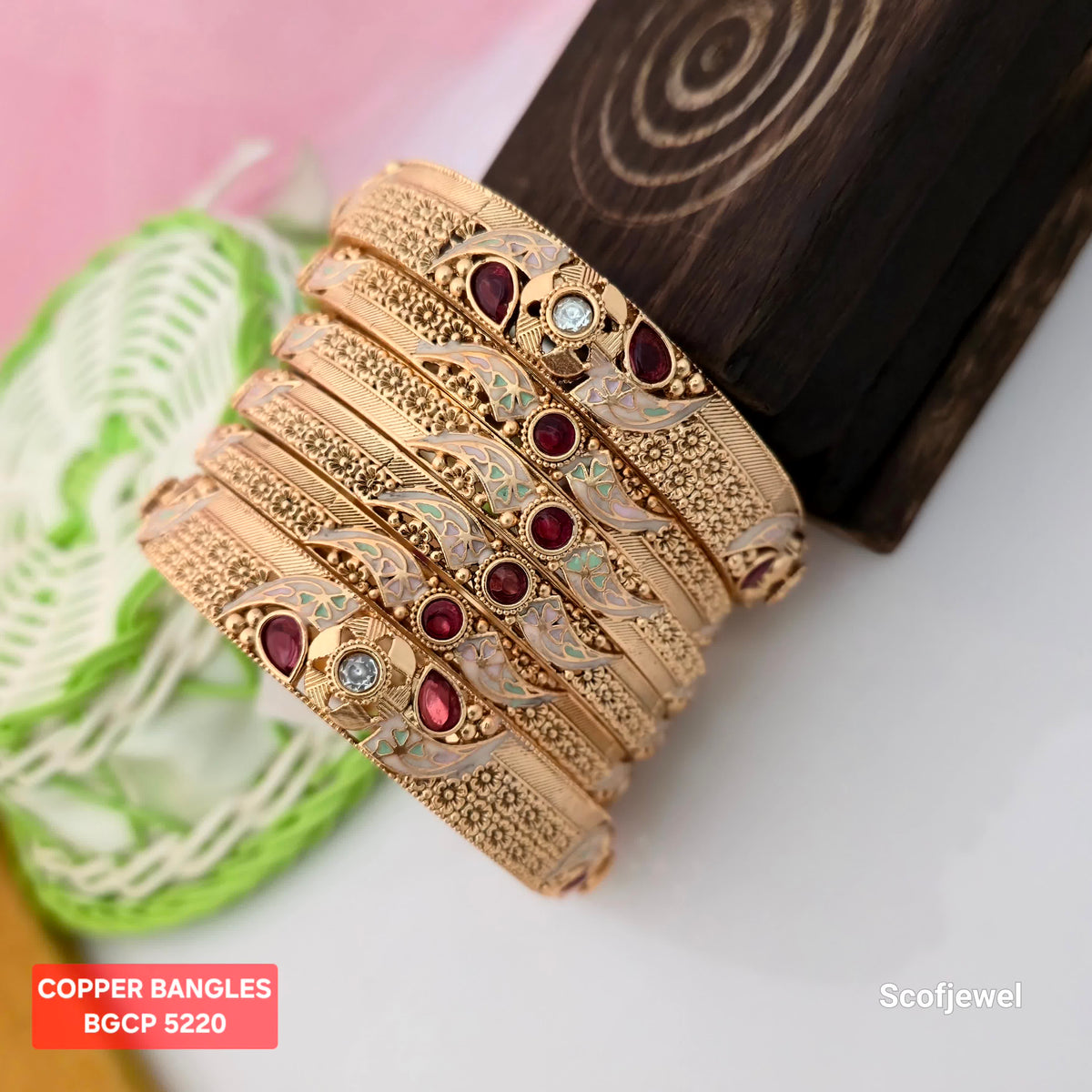 gold plated copper bangles with maroon stones, traditional gold tone bangles for women, designer copper bangles with floral patterns, maroon and white stone ethnic bangles, copper bangles with pastel green enamel-style detailing, traditional Indian wedding bangles, ornate gold plated bangles for festive wear, Scofjewel copper bangles BGCP 5220