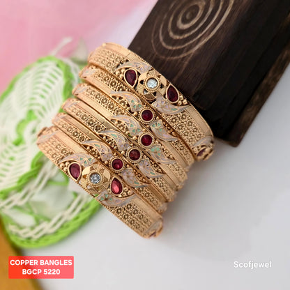 gold plated copper bangles with maroon stones, traditional gold tone bangles for women, designer copper bangles with floral patterns, maroon and white stone ethnic bangles, copper bangles with pastel green enamel-style detailing, traditional Indian wedding bangles, ornate gold plated bangles for festive wear, Scofjewel copper bangles BGCP 5220