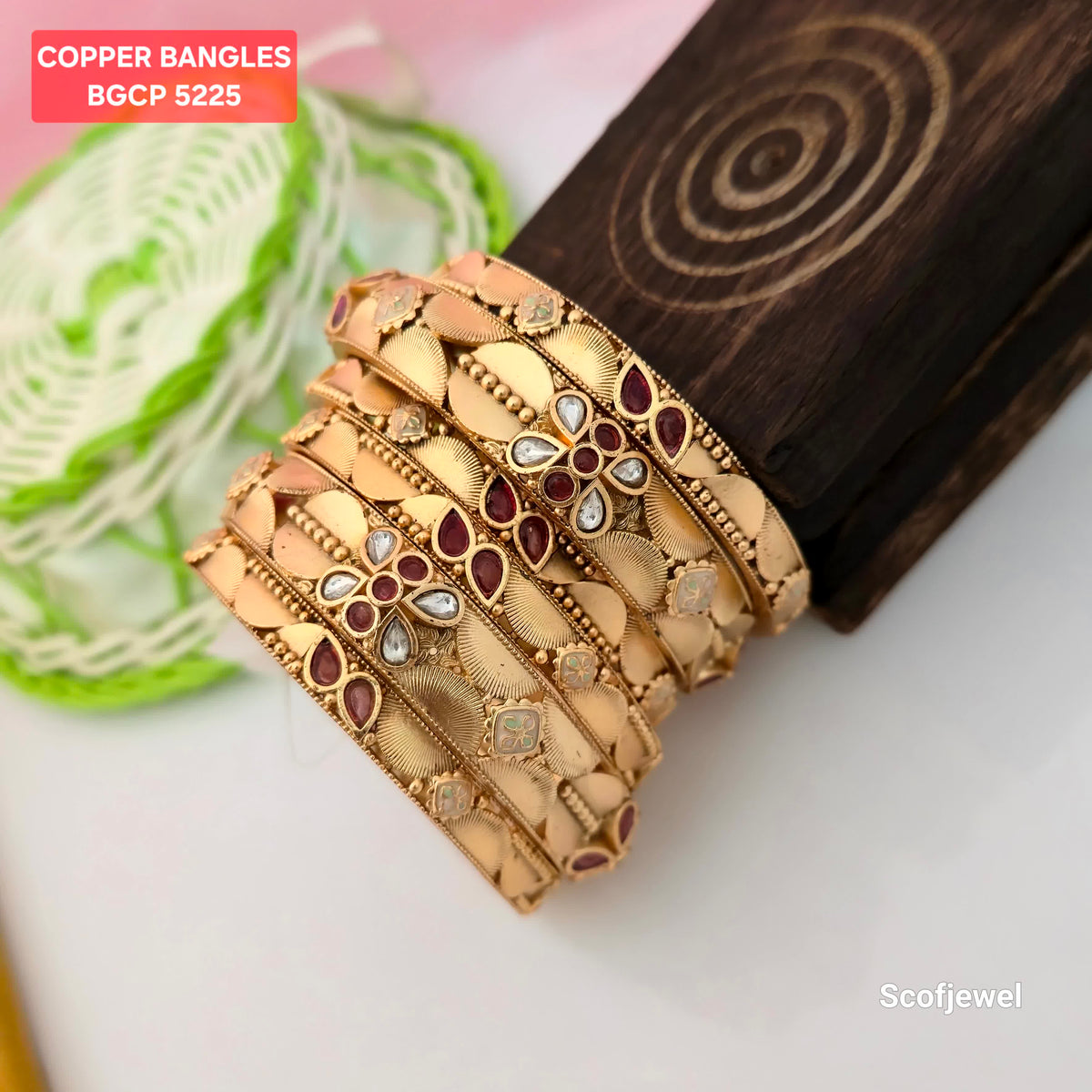 gold plated copper bangles with maroon and white stones, traditional gold tone bangles for women, designer copper bangles with leaf patterns, maroon stone ethnic bangles with white accents, ornamental copper bangles with textured detailing, traditional Indian jewellery for weddings and festivals, gold plated copper bangles BGCP 5225, Scofjewel designer bangles