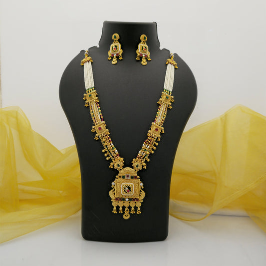 gold plated Rajwadi polish necklace set, long multistrand necklace with square pendant, traditional white bead necklace for women, gold tone artificial jewellery with red and green stones, designer Rajwadi necklace with matching earrings, traditional Indian wedding jewellery, festive ethnic necklace set