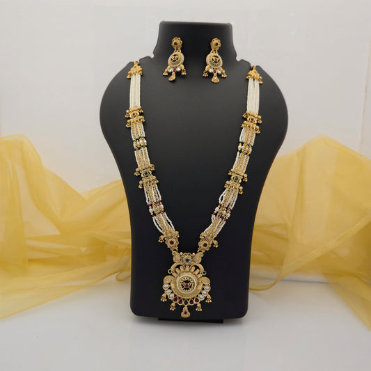 gold plated Rajwadi polish necklace set, traditional multi strand long necklace with white beads, antique gold tone necklace with circular pendant, Rajwadi necklace with matching drop earrings, green and maroon stone necklace set, traditional Indian artificial jewellery, wedding jewellery for women, festive long necklace set