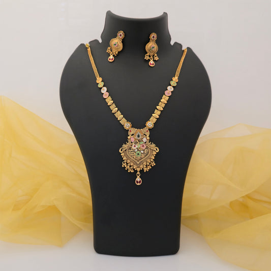 gold plated Rajwadi polish necklace set, multicolour floral pendant necklace for women, traditional gold tone artificial jewellery, ornate Rajwadi pendant with pink and green stones, matching designer drop earrings, ethnic necklace set for weddings, festive wear jewellery for women