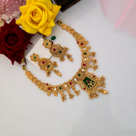 Gold plated Rajwadi polish short necklace set with traditional square pendant, green enamel detailing, red green and white stones, antique gold finish and matching floral earrings for women