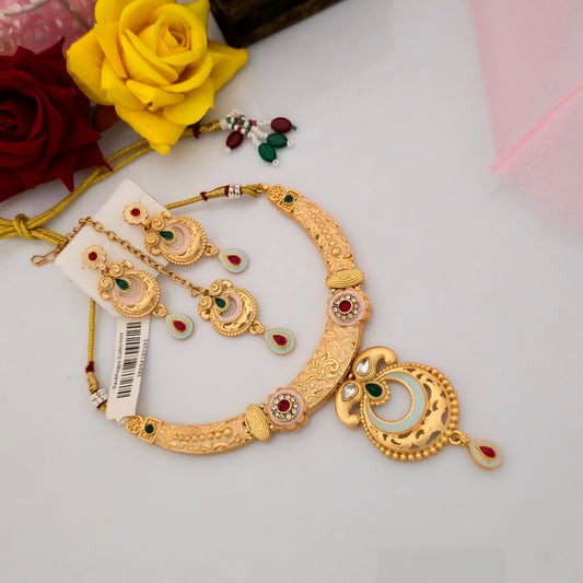 Gold plated Rajwadi polish short necklace set with peach enamel crescent pendant, turquoise-blue accents, red and green stone embellishments, intricate gold-tone detailing and matching traditional earrings for women
