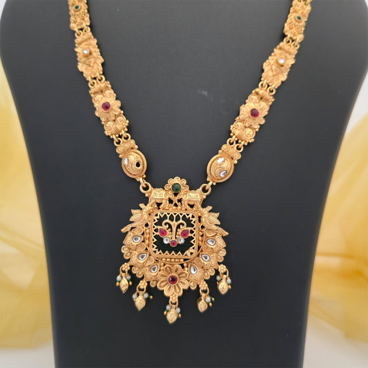 gold plated Rajwadi polish necklace, traditional elephant pendant necklace, square ornamental pendant with elephant motifs, gold tone floral necklace with maroon and green stones, traditional Indian artificial jewellery, designer Rajwadi necklace for women, antique gold finish statement necklace, ethnic wedding jewellery