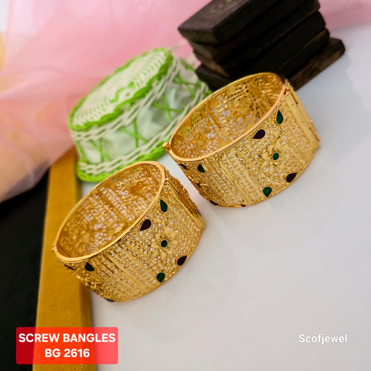 gold plated screw bangles for women, broad golden bangles with floral detailing, traditional gold bangles with green and maroon accents, designer screw bangles with intricate patterns, gold tone ethnic bangles for weddings, floral design bangles for festive wear, BG 2616 gold plated bangles, Scofjewel traditional bangles