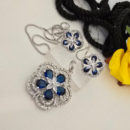 Jewelry_set_with_blue_flower-shaped_stones_on_a_light_background - Saubhagya Collection 