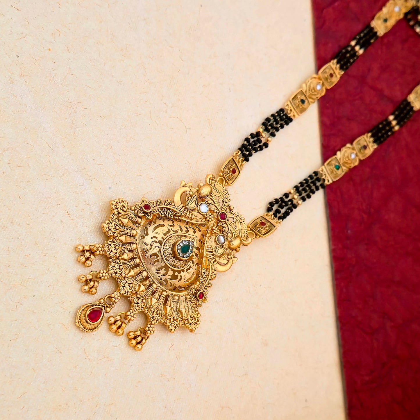 Designer Gold Plated Mangalsutra Set with Antique Peacock Pendant & Multicolor Stone Detailing | Black Bead Traditional Jewellery
