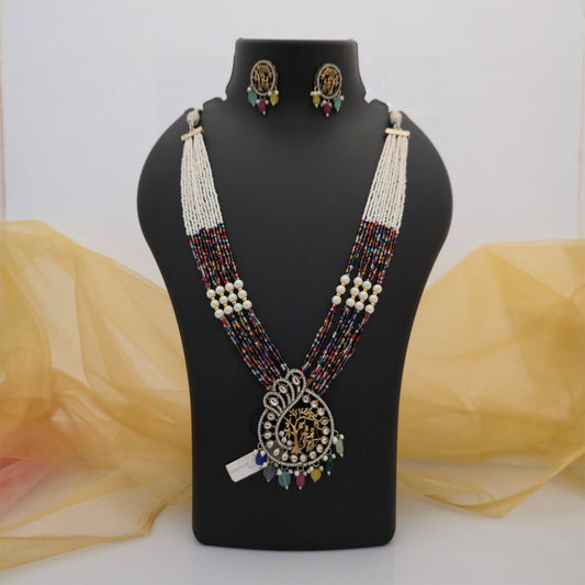 multicolour beaded necklace set with matching earrings, traditional temple pendant necklace for women, multistrand white and colourful bead necklace, gold tone ethnic necklace with decorative pendant, Indian traditional jewellery set for festive wear, designer beaded necklace with colourful dangling beads, statement necklace set for women, Scofjewel traditional necklace