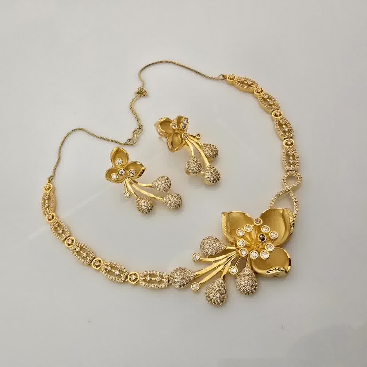 1.5 Gram Gold (Forming) Gold Tone White Stone AD/Zirconia Floral Drop Necklace Set | Designer Flower Pendant Necklace with Earrings for Women