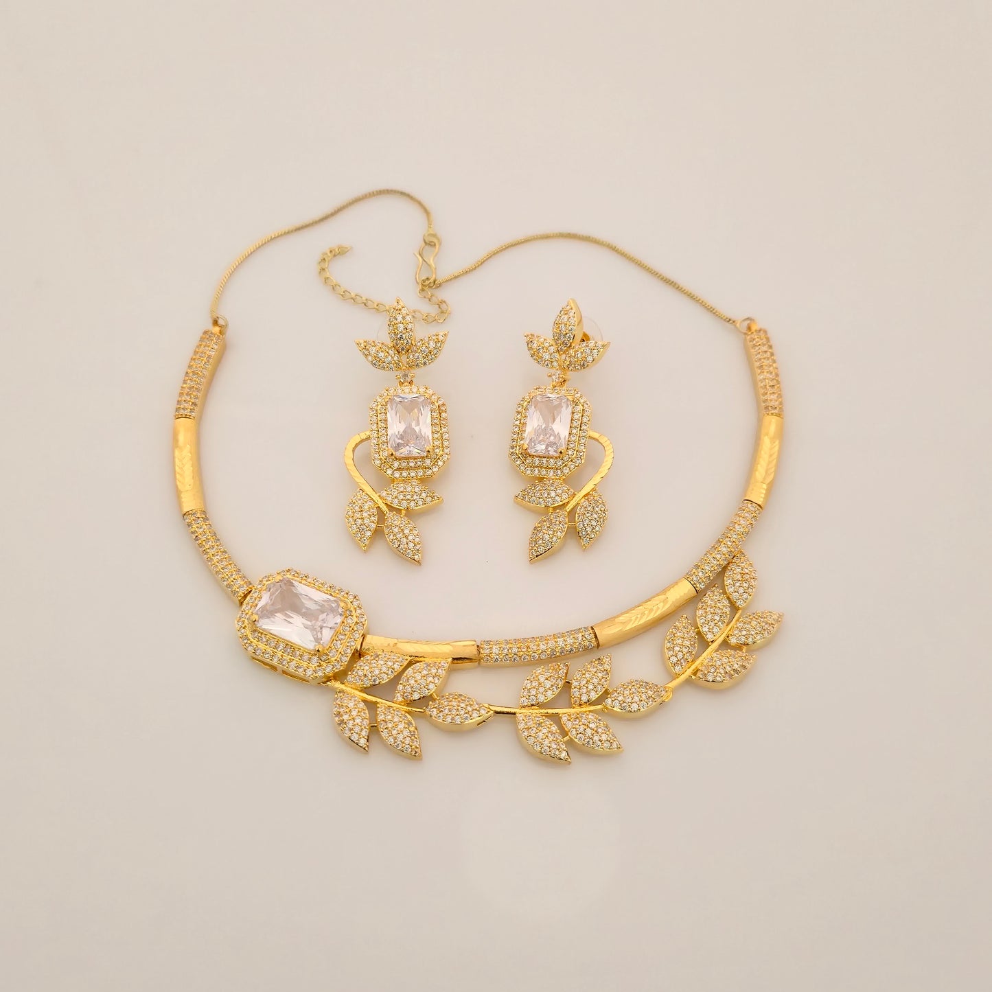 1.5 Gram Gold (Forming) Gold Tone Pink Stone AD/Zirconia Leaf Design Necklace Set | Elegant Designer Necklace with Earrings for Women