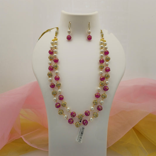 pink and cream pearl beads double layer long necklace mala set, pink decorative beads with gold tone detailing, cream pearl-style bead necklace with matching earrings, traditional artificial jewellery set for women, double layer pink necklace for festive wear, elegant imitation necklace mala with embellished gold tone beads