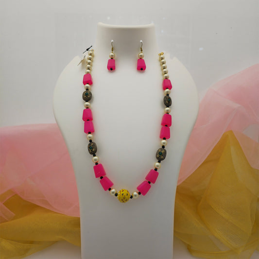 pink and cream pearl beads long necklace mala, pink rectangular bead necklace with cream pearls, gold tone necklace mala with matching earrings, colourful artificial jewellery set for women, traditional pink necklace set for festive wear, designer long imitation necklace with yellow centre bead