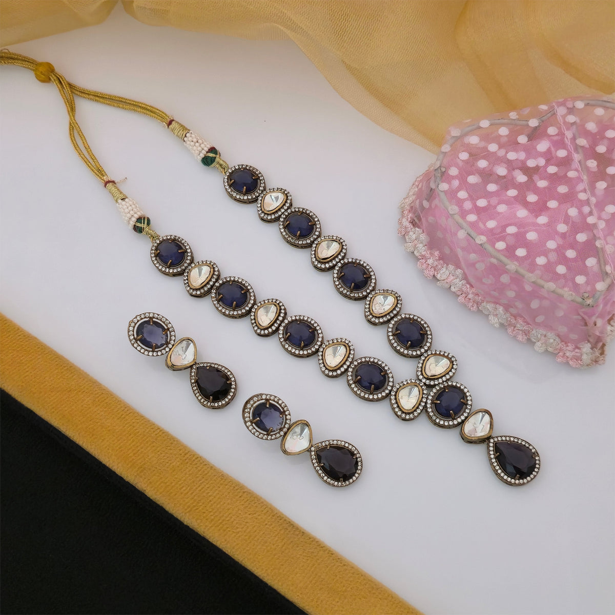 purple and white Moissanite Kundan necklace set with matching earrings, purple stone designer necklace for women, traditional Kundan-style jewellery set with teardrop pendant, antique gold-tone necklace with purple and white stones, elegant purple bridal necklace set, artificial jewellery for weddings and festive occasions, Scofjewel purple Kundan necklace