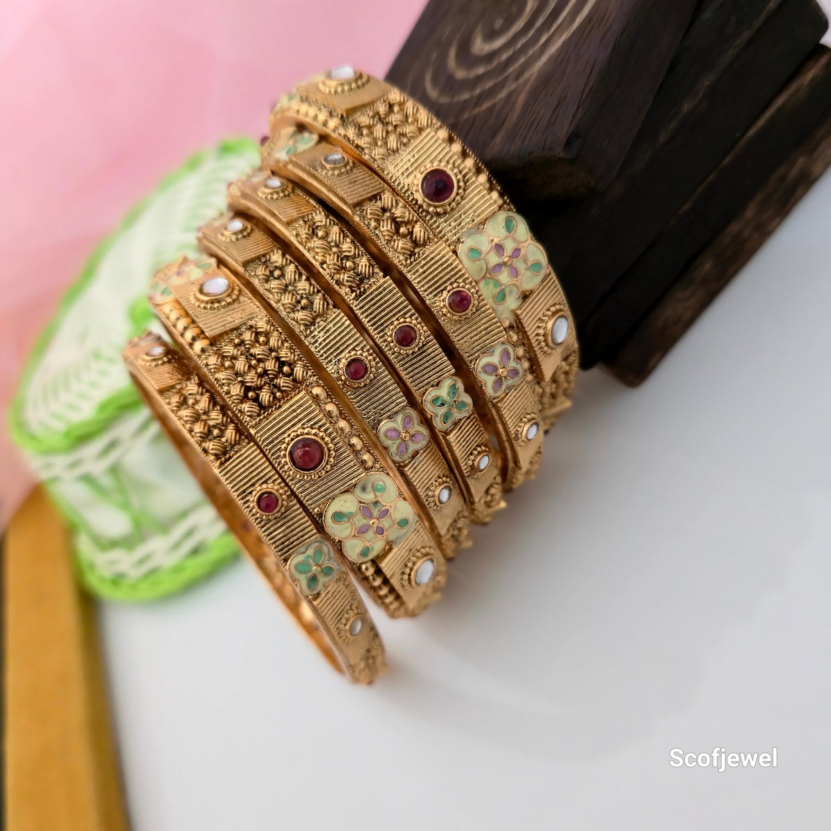 Rajwadi polish antique gold bangles with maroon stones, traditional designer bangles with mint green and lavender floral motifs, antique gold tone engraved bangles for women, pastel floral Rajwadi jewellery, traditional Indian bangles for wedding wear, maroon and white accent bangles, ethnic imitation jewellery for women, Scofjewel Rajwadi bangles