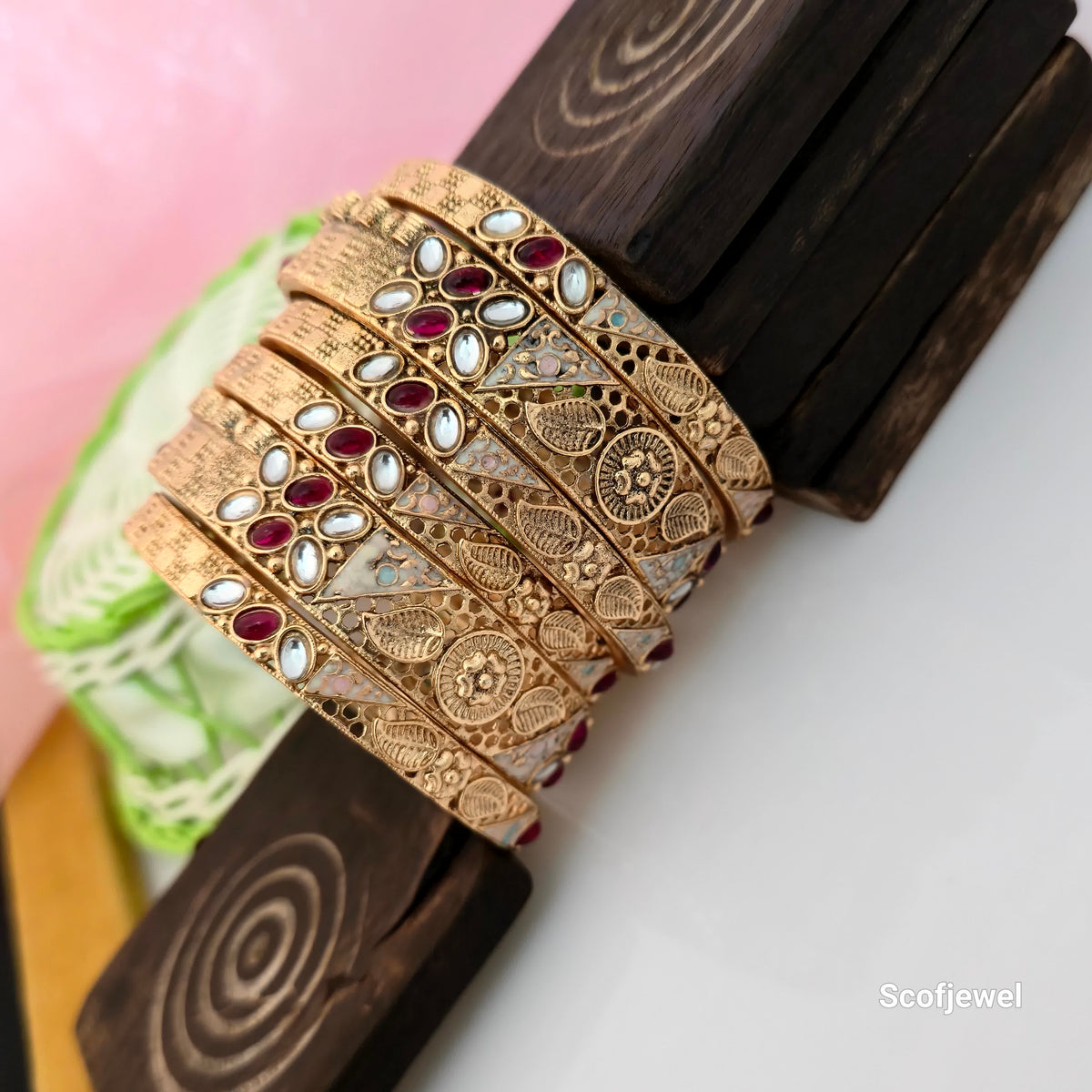 ajwadi polish antique gold bangles for women, traditional gold tone bangles with red and white stones, designer ethnic bangles with intricate engraved patterns, antique finish Rajwadi style jewellery, traditional wedding bangles for women, red and white stone embellished bangles, royal Indian imitation jewellery, Scofjewel Rajwadi bangles