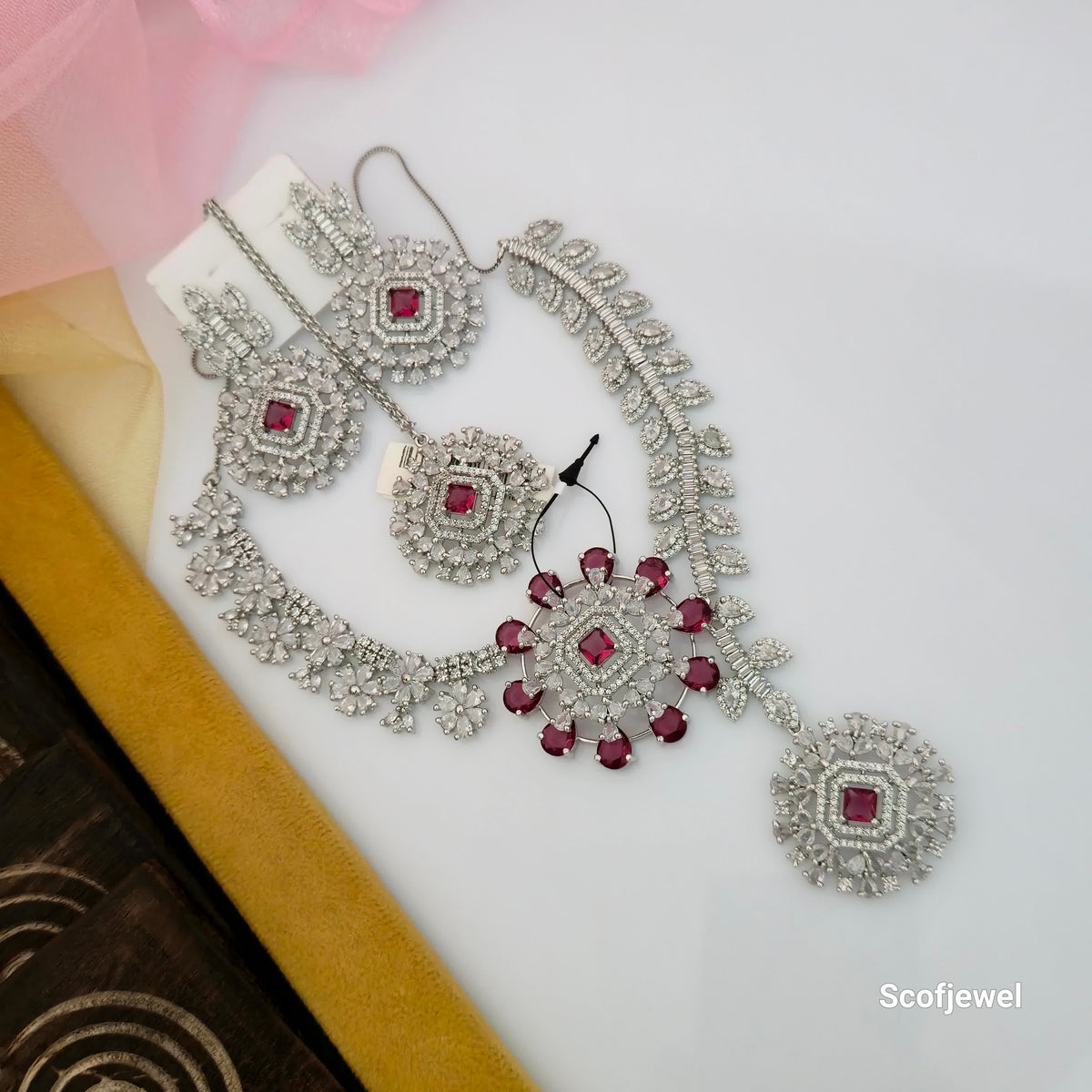 ruby pink and white AD necklace set with matching earrings, American Diamond designer necklace for women, ruby pink stone necklace with silver tone finish, floral AD jewellery set with centre pendant, traditional Indian imitation jewellery for weddings, pink and white AD necklace for festive occasions, Scofjewel ruby pink necklace set