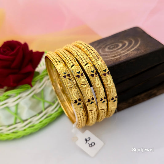 set of four gold tone traditional bangles for women, gold finish designer bangles with green and maroon accents, textured gold bangles with engraved patterns, multicolour enamel style ethnic bangles, traditional Indian imitation jewellery bangles, festive wear bangles for women, gold tone bangles for saree and lehenga, Scofjewel designer bangles