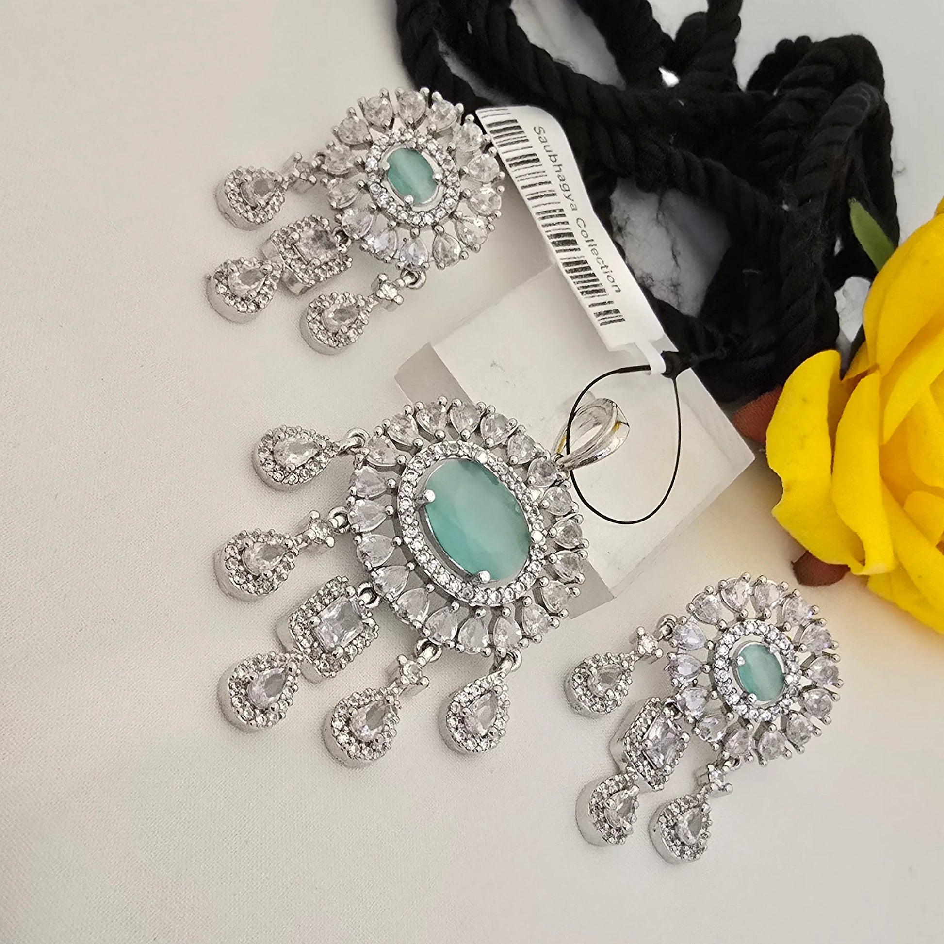 Silver_jewelry_set_with_green_stones_on_a_white - Saubhagya Collection 