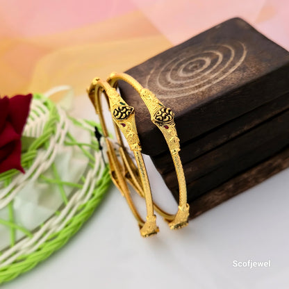 traditional gold tone designer bangles for women, antique black engraved bangles, gold finish ethnic bangles with red and green accents, traditional Indian imitation jewellery bangles, decorative gold tone bangles for festive wear, designer bangles for saree and lehenga, Scofjewel traditional bangles
