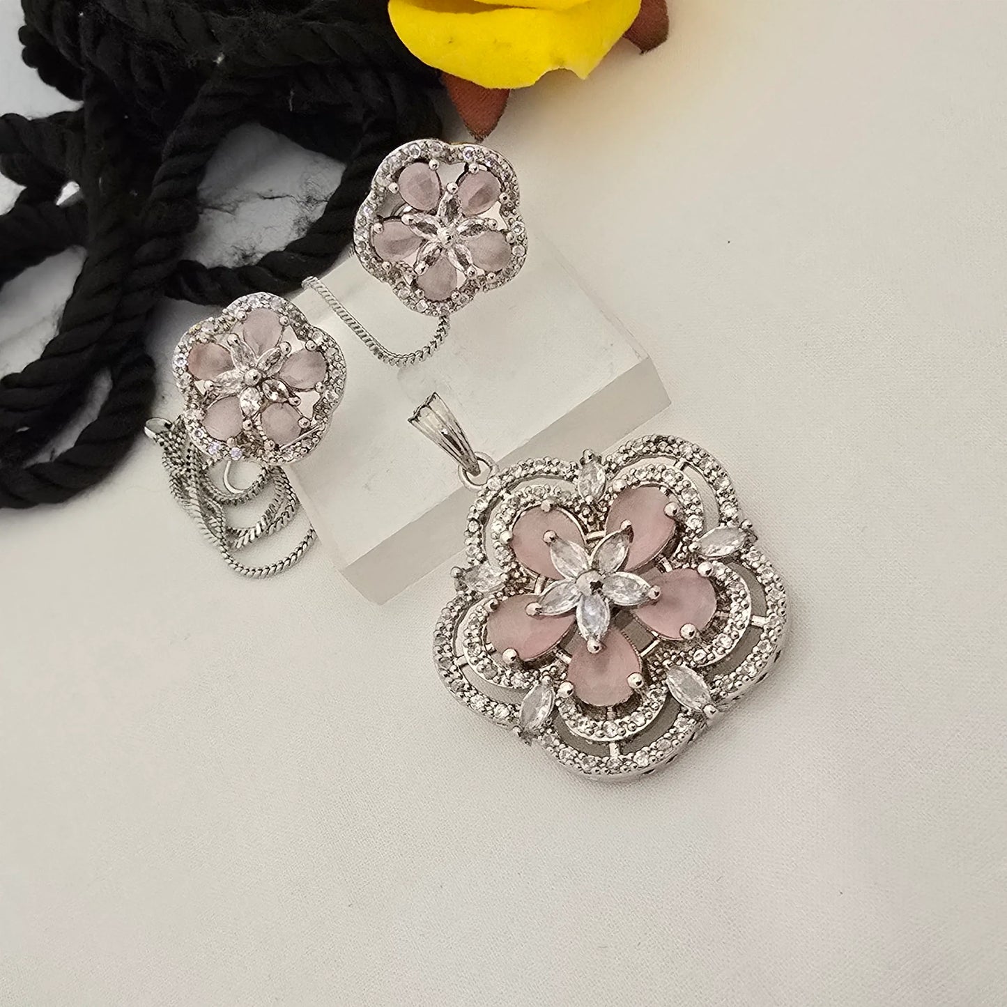 pink_floral_jewelry_set_with_clear_stones_on_a_white_surface - Saubhagya Collection 