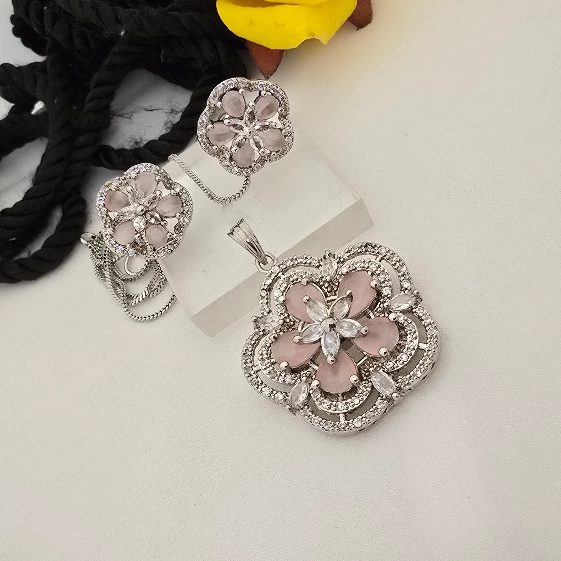 pink_floral_jewelry_set_with_clear_stones_on_a_white_surface - Saubhagya Collection 